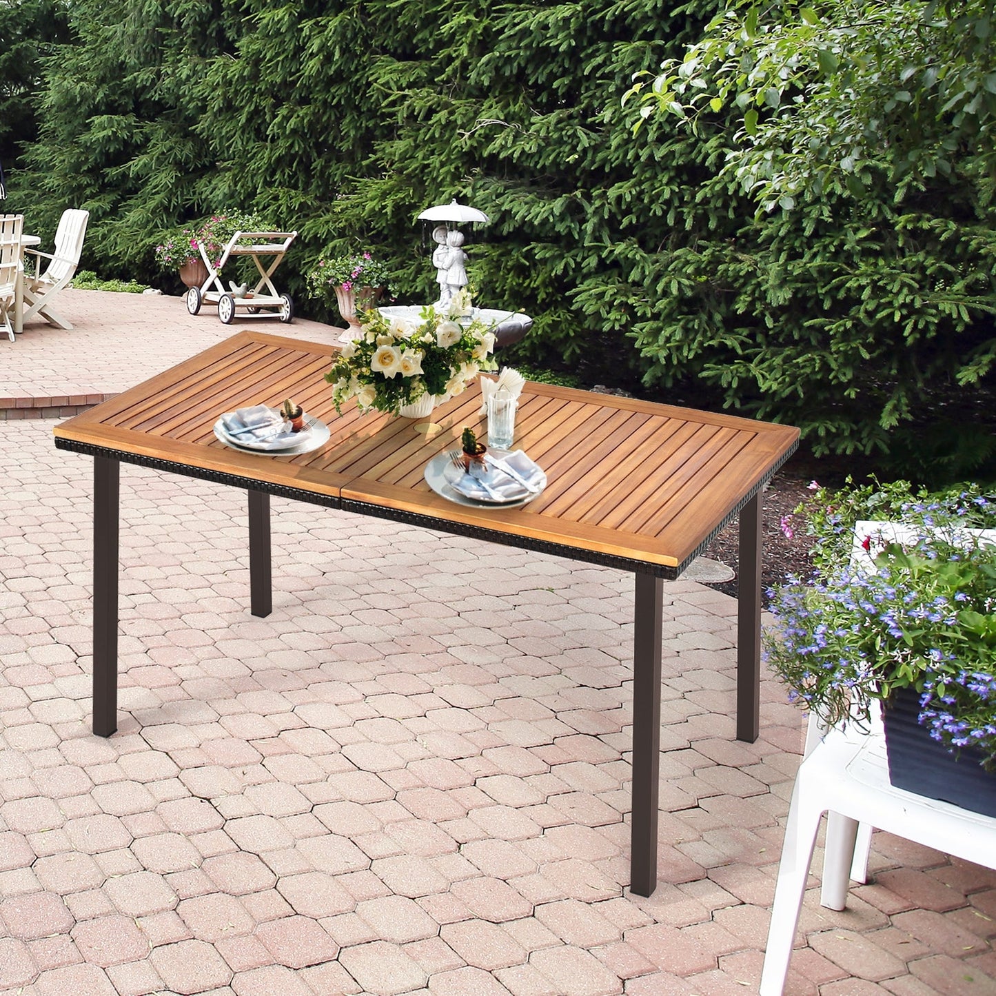 55 Inch Patio Acacia Dining Table with Umbrella Hole set up in outdoor patio, featuring slatted wooden surface and decorative tableware.