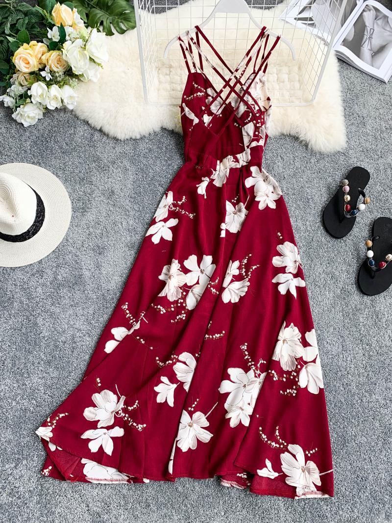 Floral print women’s belted waist dress with crisscross straps, perfect for sunny days or casual outings.