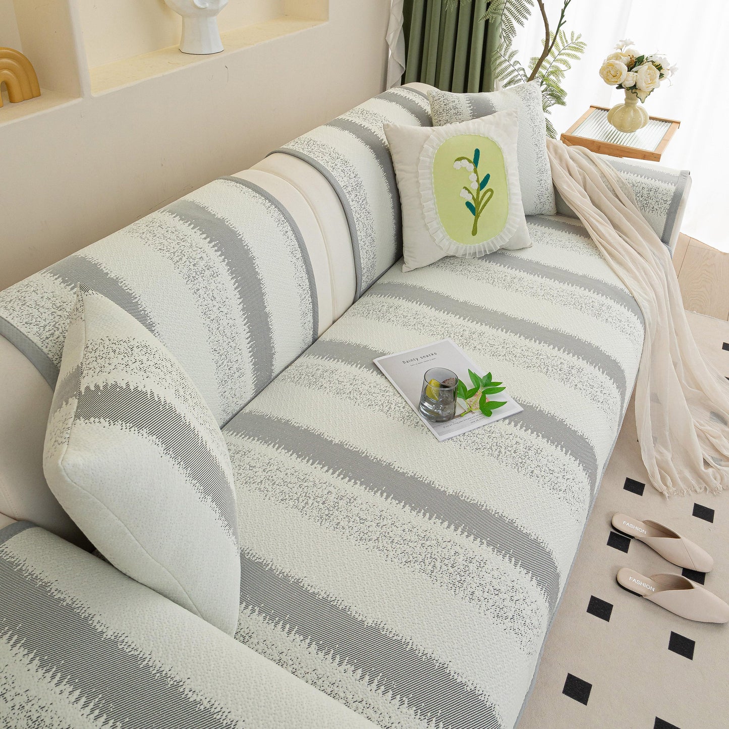 Striped Non-Slip Cooling Couch Cover, Summer Couch Pads for Seat Back Armrest on modern sofa with decorative pillows.