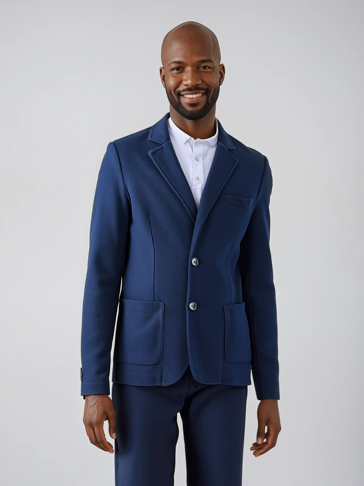 Man wearing sophisticated navy Knit Blazer with floral paisley lining and patch pockets, ideal for versatile elegant styling.
