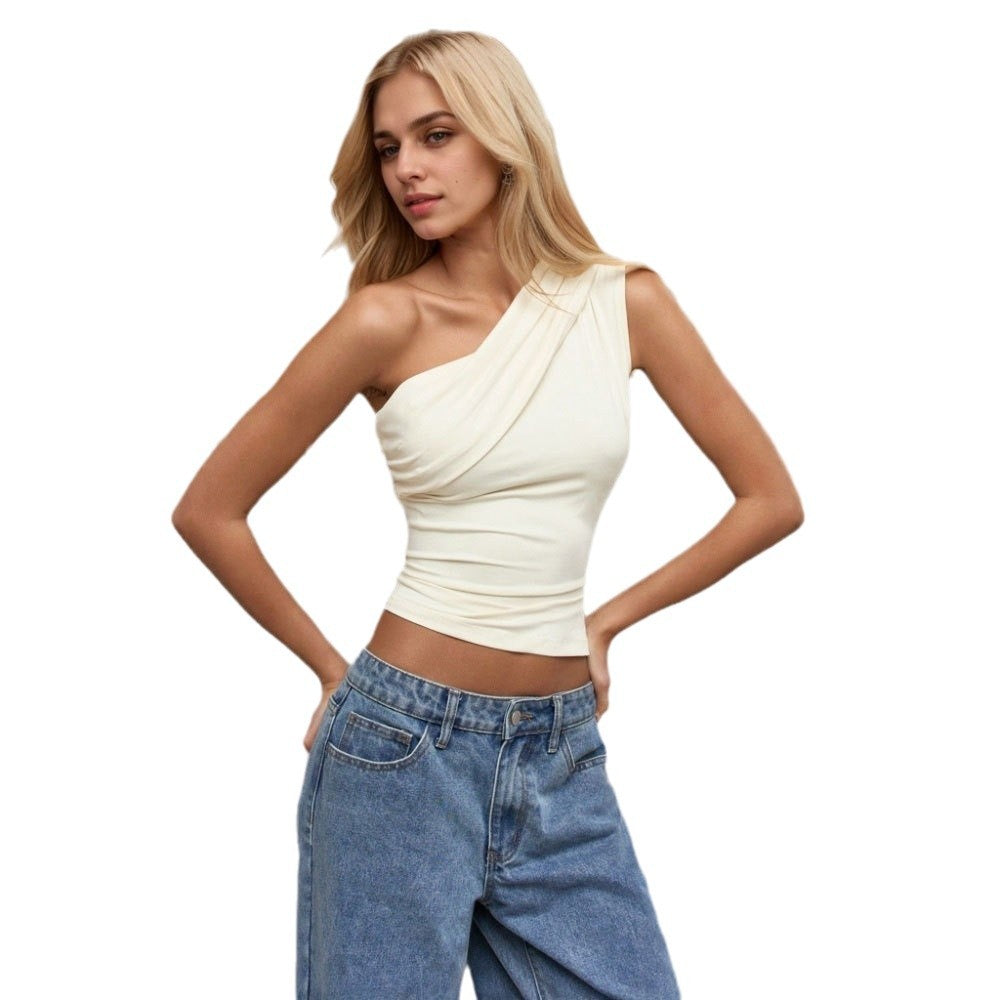 Woman wearing Sierra Slant Off-Shoulder Top in apricot with jeans, showcasing a chic cowgirl style.