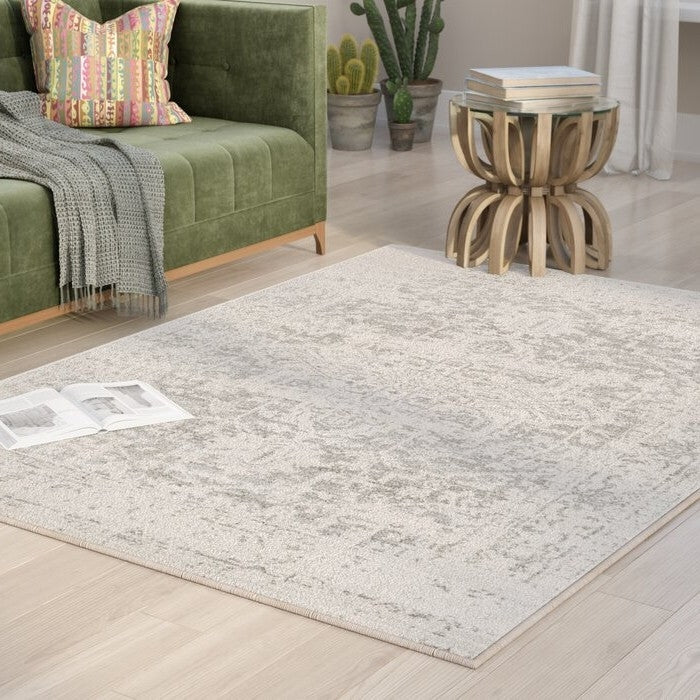 3' x 5' Distressed Oriental Area Rug in Light Grey / Beige in living room setting