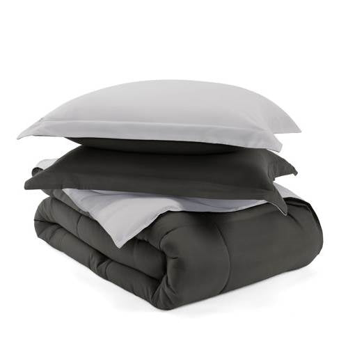 Full/Queen 3-Piece Microfiber Reversible Comforter Set in Grey / Light Grey displayed with pillows stacked on the comforter.