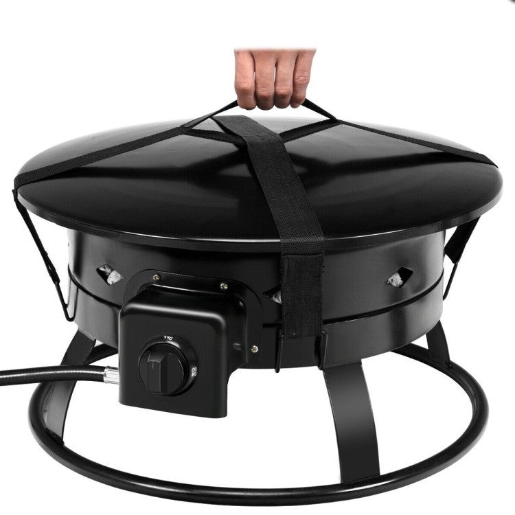 Hand lifting Portable Outdoor Black Metal Propane Fire Pit with Cover and Carry Kit, showing compact design and carry straps.