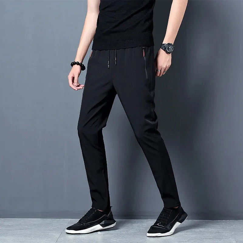 Model wearing black Slim Fit Stretch Jogger Pants with Elastic Waist, showcasing style and comfort for casual wear.