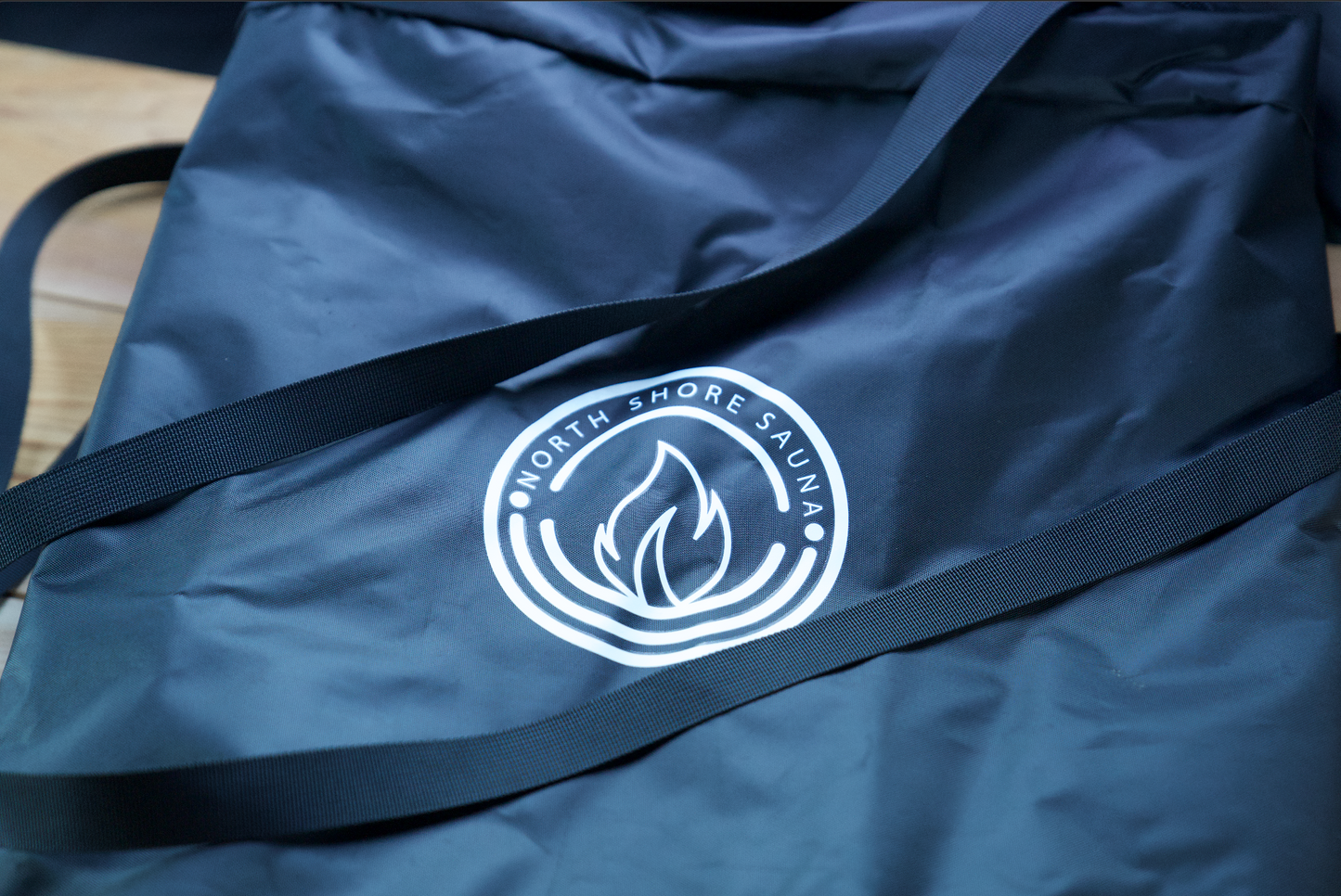 Portable Sauna Bench carrying bag with logo, ideal for transporting your sauna bench for an enhanced warming experience.