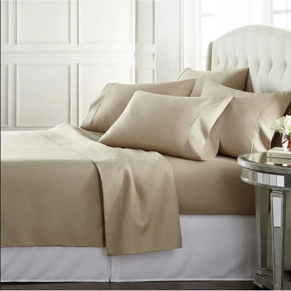 Full size Taupe 100-Percent Egyptian Cotton 1000 Thread Count 4-Piece Sheet Set displayed on a stylish bed.
