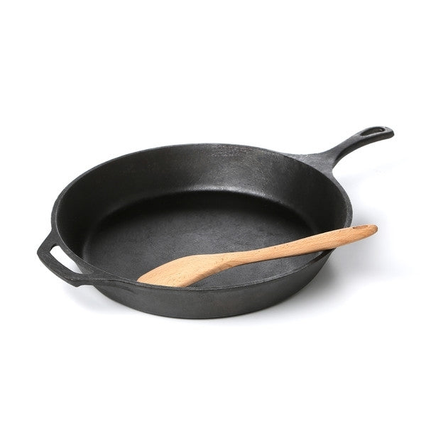 Pre-Seasoned Cast Iron 14-inch Round Skillet with a wooden spatula showcased on a white background.
