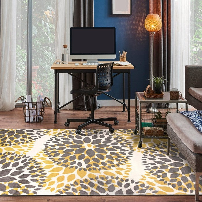 3'1" x 5' Grey Yellow Floral Woven Stain Resistant Polypropylene Area Rug in a cozy living room setting