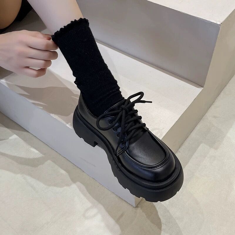 Women’s British Style Chunky Sole Leather Shoes – Trendy Loafers with Elevated Heel in black leather on staircase