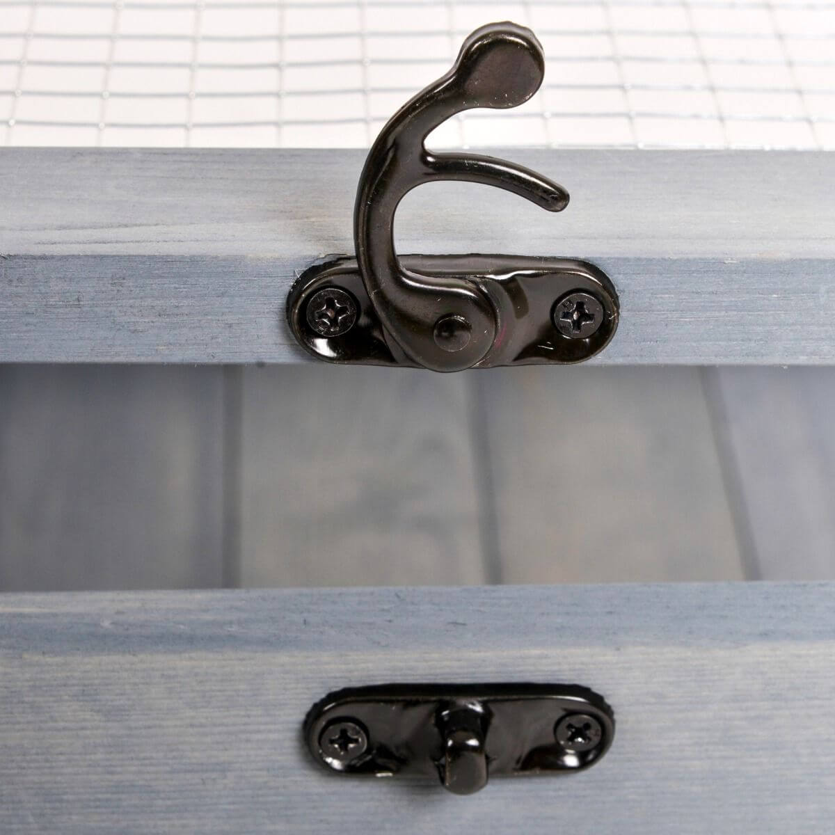 Close-up of latch on PawHut Wooden Tortoise House Indoor Turtle Habitat Enclosure Outdoor Reptile Cage Gray.