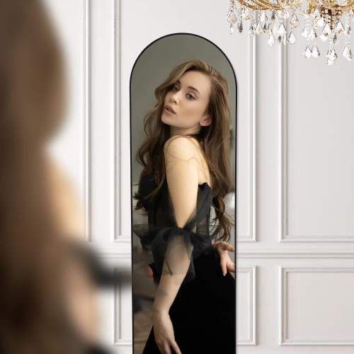 Woman posing in front of Floor Standing Mirror with aluminum alloy thin frame, perfect for a full view, enhancing home decor.