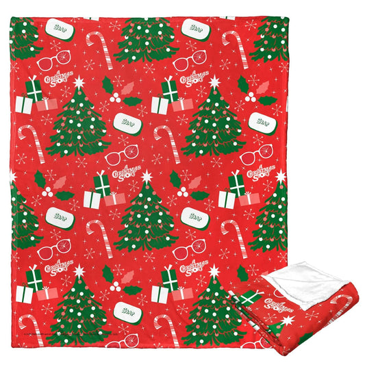 A Christmas Story Silk Touch Throw Blanket 50x60 featuring holiday-themed pattern with Christmas trees, candy canes, and gifts.