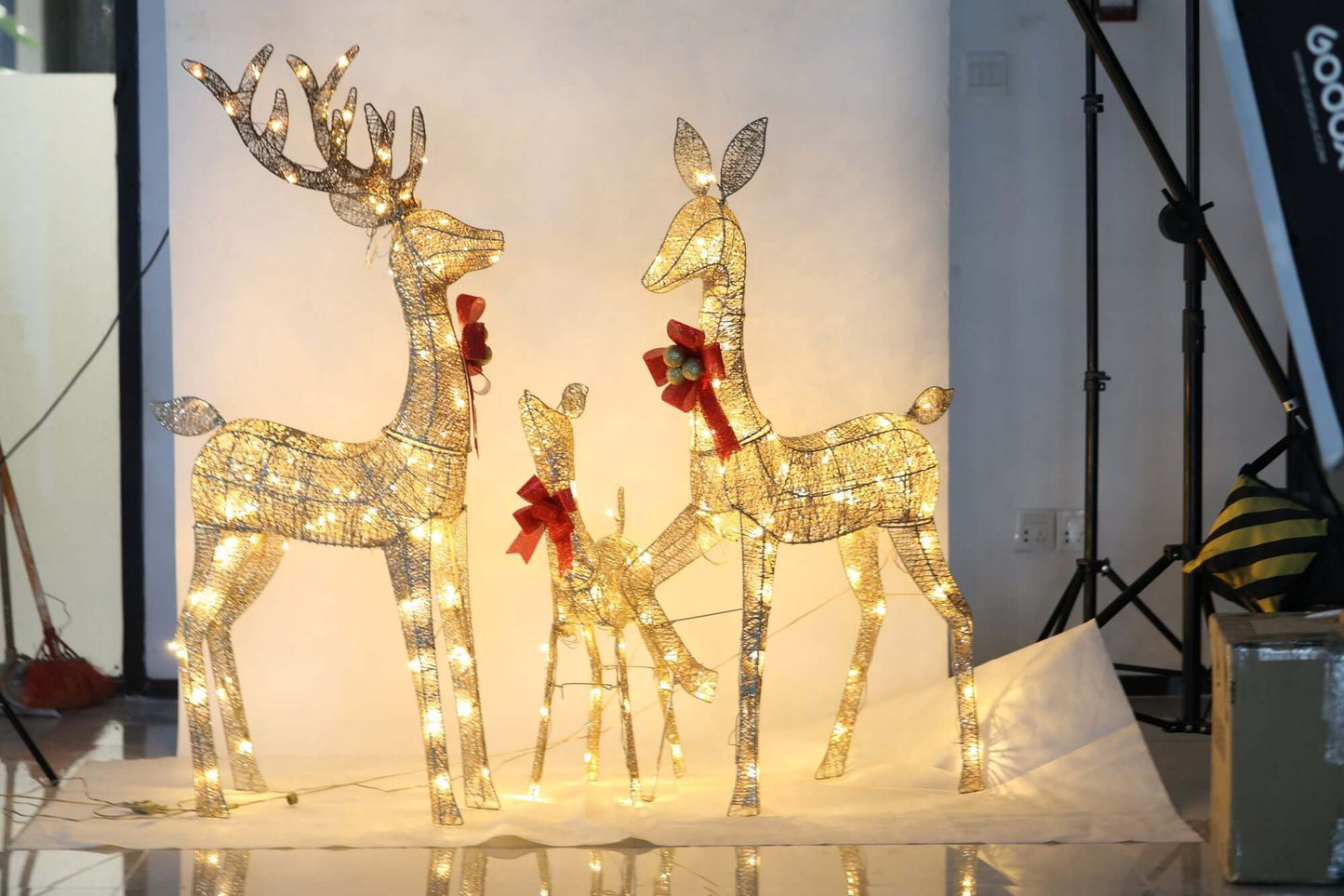 Lighted Christmas Deer Family Set Outdoor with 3-piece illuminated reindeer, 5ft tall, creating a magical winter wonderland display.