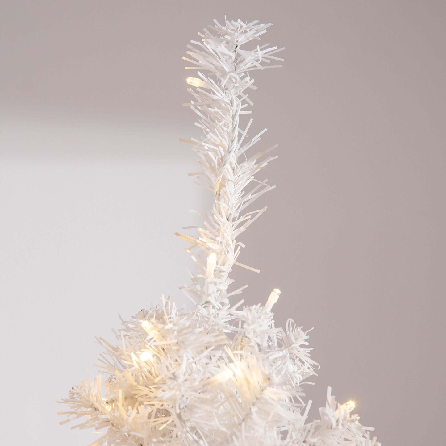 White Christmas Tree with 250 warm white LED lights, showcasing its pre-lit branches in a festive holiday setting.