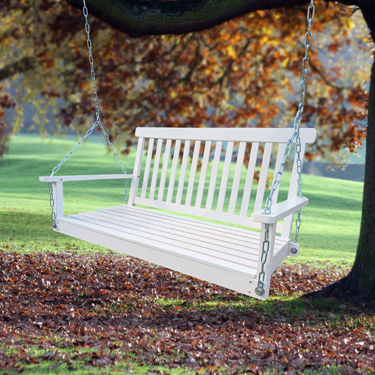 Wood Porch Swing with Armrests in white, hanging outdoors on a tree, offering a relaxing seating experience.