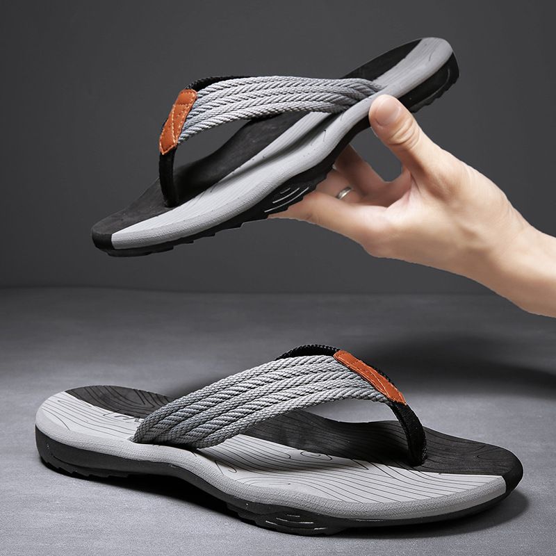 Alt Tag: Men's anti-skid flip flops with lightweight rubber soles and gray straps, ideal for beach outings and casual comfort.