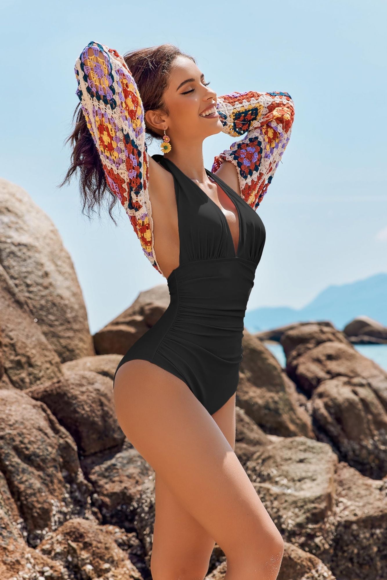 V-Neck One-Piece Swimsuit for Women in a chic black gathered design against a beach background