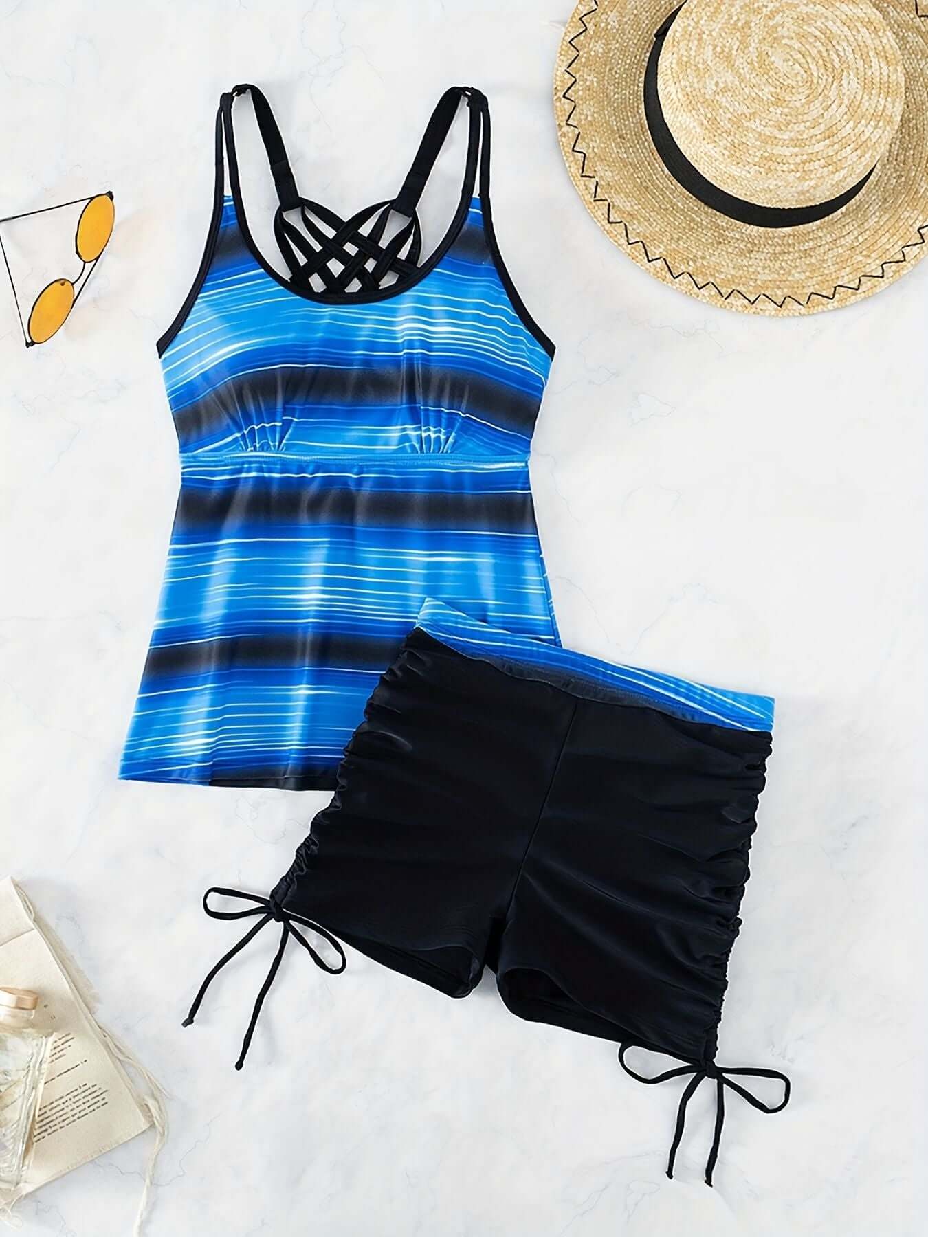 Alt Tag: Striped print round neck tankini with criss cross strap and drawstring boxer shorts by The Tabby Spot. Women's swimwear.