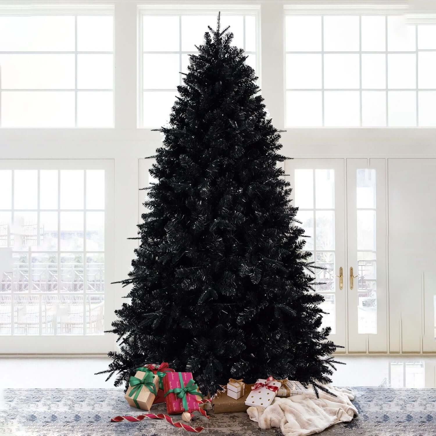 Black Christmas Tree with White LED Lights - 5ft holiday decor with presents at the base, set in a bright windowed room.