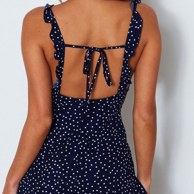 Back view of Women Summer Fashion Beach Sundress with polka dots and tie detail, ideal for casual outings.