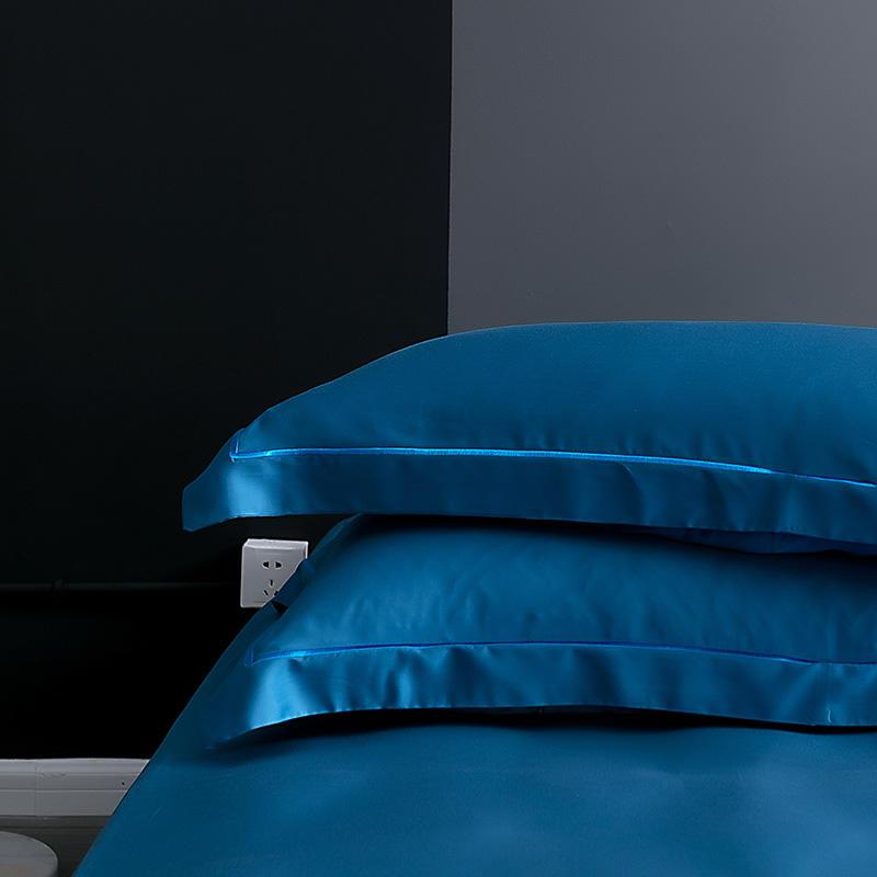 Karen Solid Color Lyocell Duvet Cover Set in blue with a modern and boho style, made of Tencel Lyocell, displayed in a bedroom setting.