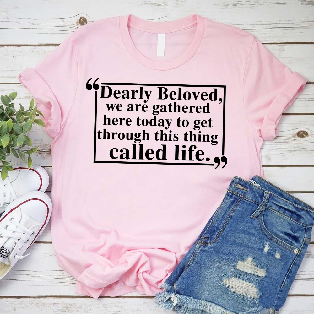 Pink Dearly Beloved Tee Unisex Funny Quote Shirt with ripped jeans and sneakers on wooden background