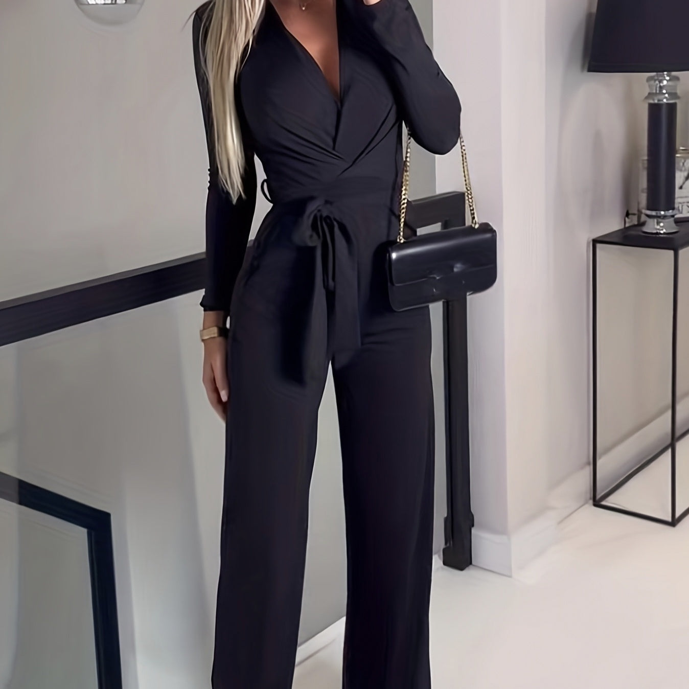 Ladies' Fashionable Slim Fit Sexy V-neck Long Sleeved Slimming Jumpsuit, elegant and chic black outfit for stylish women.