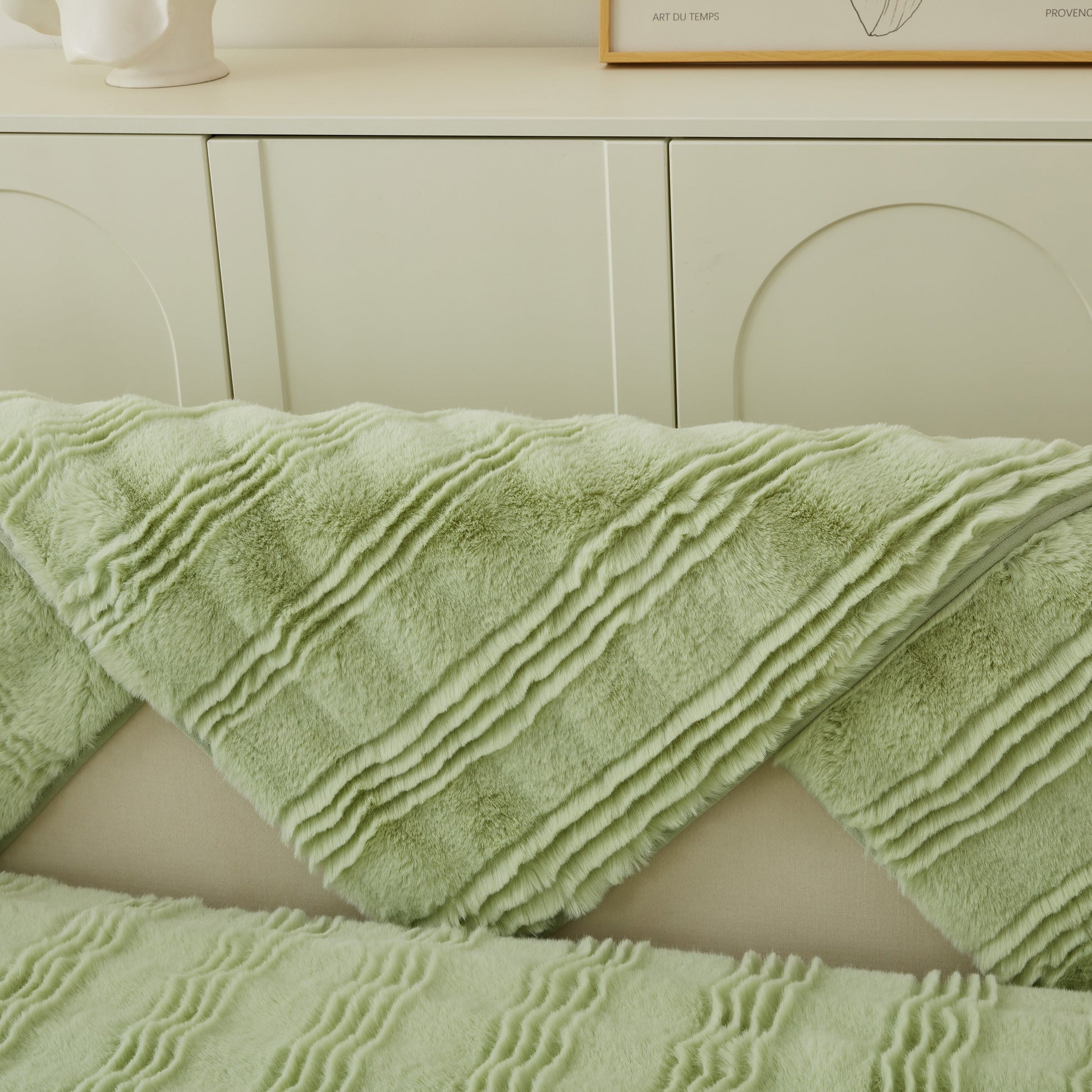 Soft Thick Faux Fur Sofa Cover Stripe Fluffy Fuzzy Non-Slip Washable Couch Covers draped over a light-colored sofa.