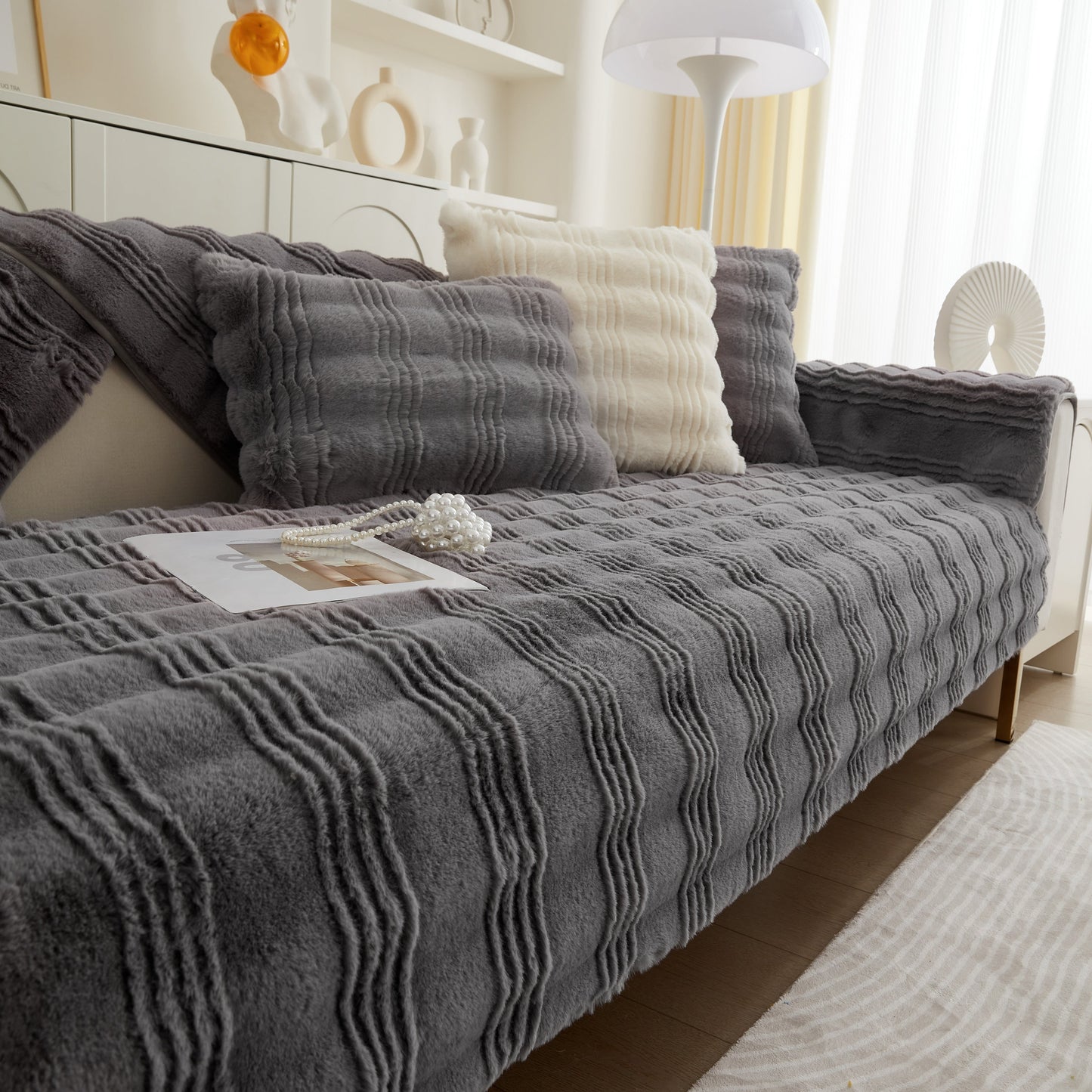 Soft Thick Faux Fur Sofa Cover Stripe Fluffy Fuzzy Non-Slip Washable Couch Covers on a stylish living room couch.
