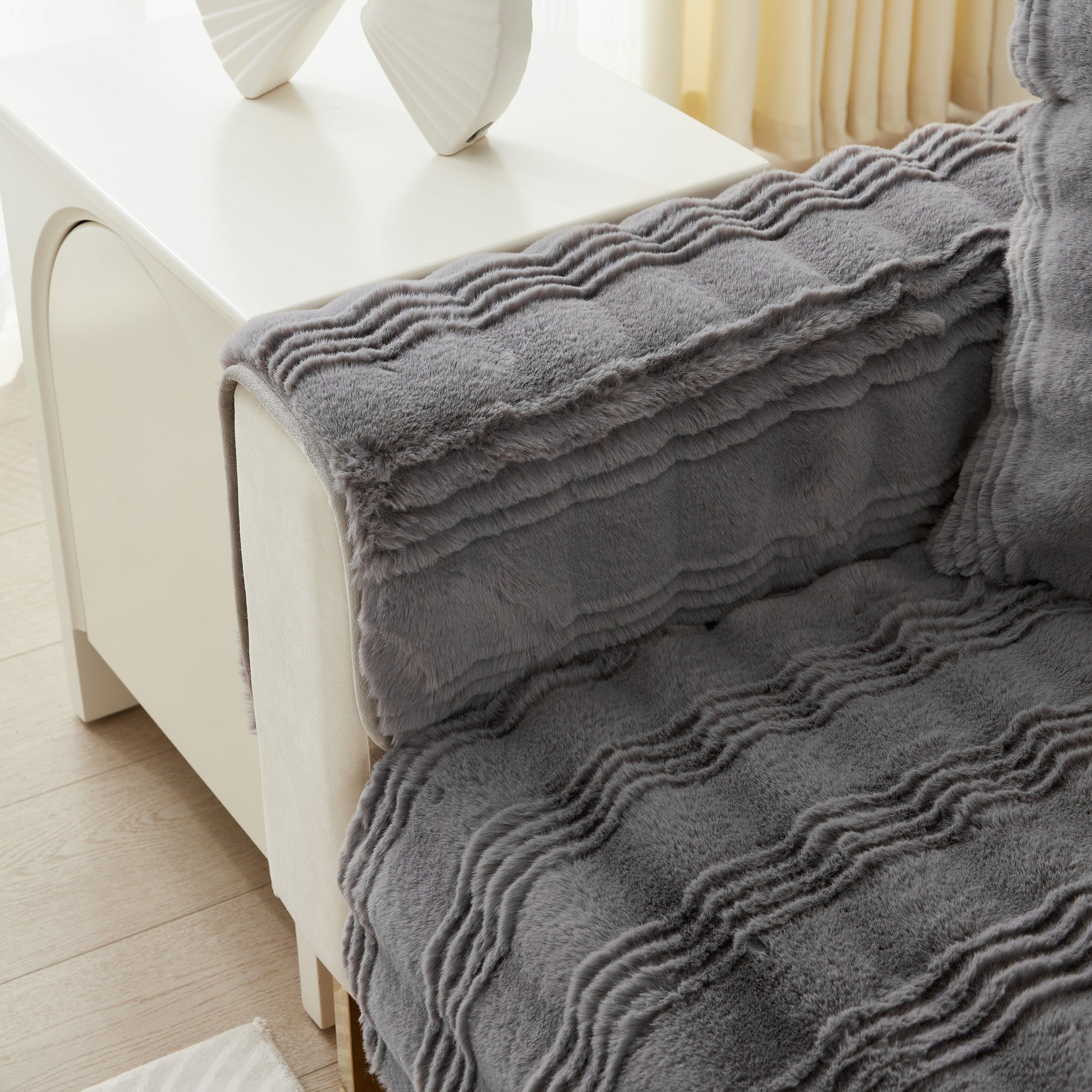 Soft Thick Faux Fur Sofa Cover Stripe Fluffy Fuzzy Non-Slip Washable Couch Covers on a modern sofa in a stylish living room setting.
