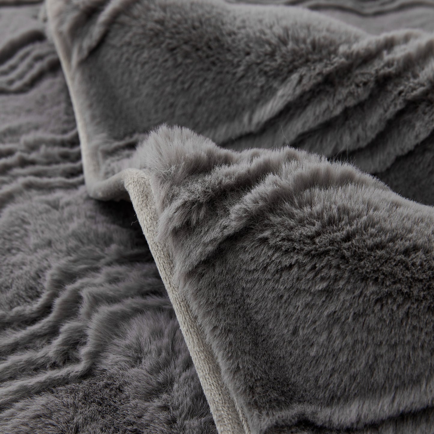 Soft Thick Faux Fur Sofa Cover Stripe Fluffy Fuzzy Non-Slip Washable Couch Covers in grey faux rabbit plush texture.