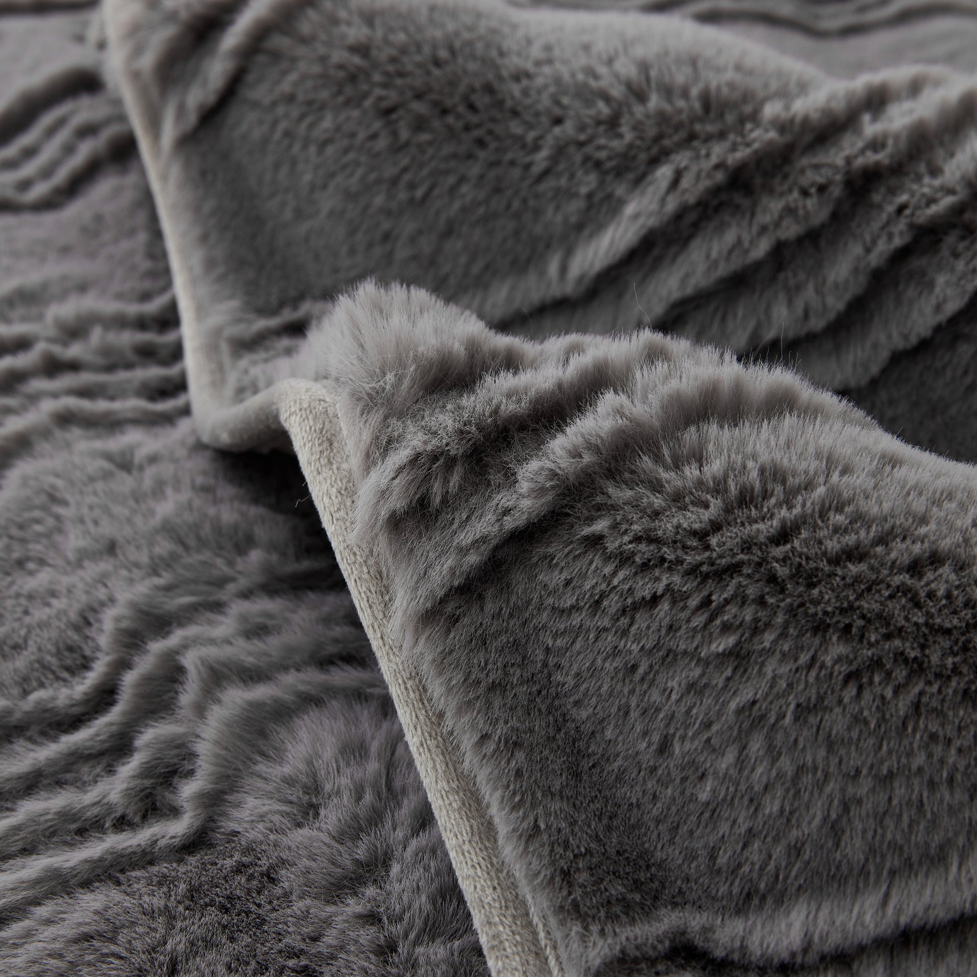 Soft Thick Faux Fur Sofa Cover Stripe Fluffy Fuzzy Non-Slip Washable Couch Covers in grey faux rabbit plush texture.