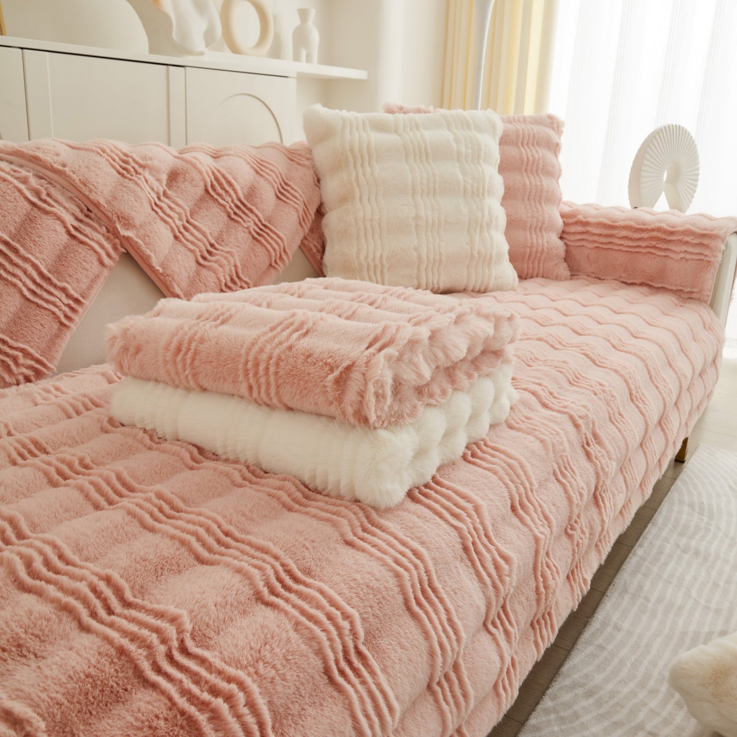 Soft Thick Faux Fur Sofa Cover Stripe Fluffy Fuzzy Non-Slip Washable Couch Covers on a pink couch with matching pillows