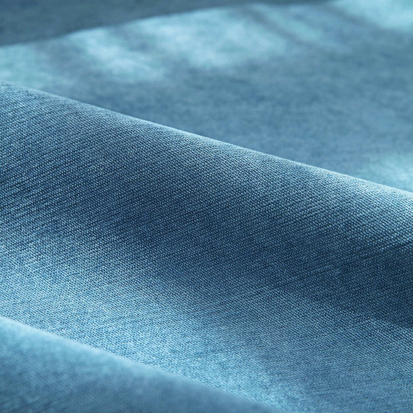 Close-up of blue Waterproof Non-Slip Quilted Corduroy Sofa Covers for Pets, Sectional Couch Covers fabric texture