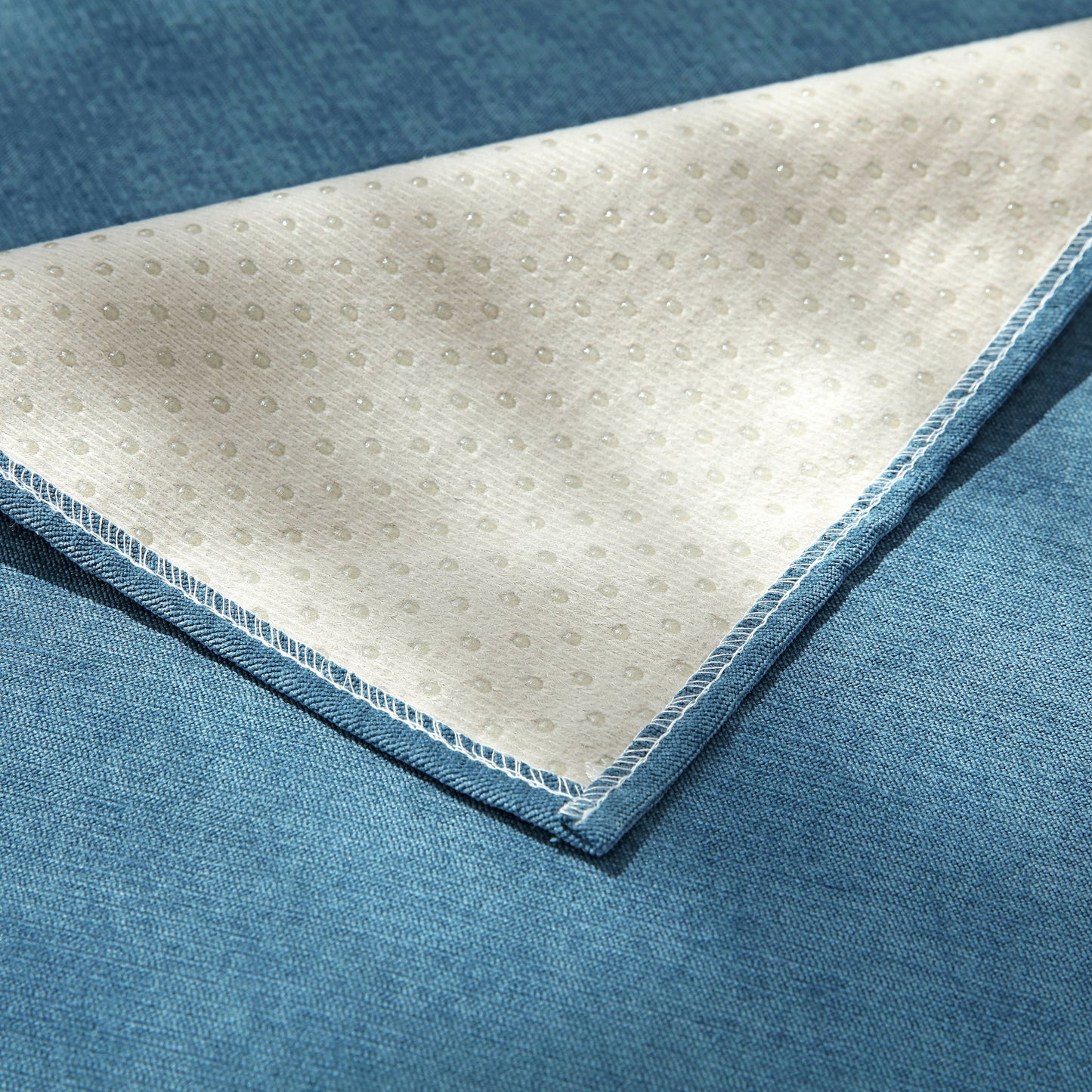 Underside view of Waterproof Non-Slip Quilted Corduroy Sofa Covers for Pets, Sectional Couch Covers showing non-slip texture.