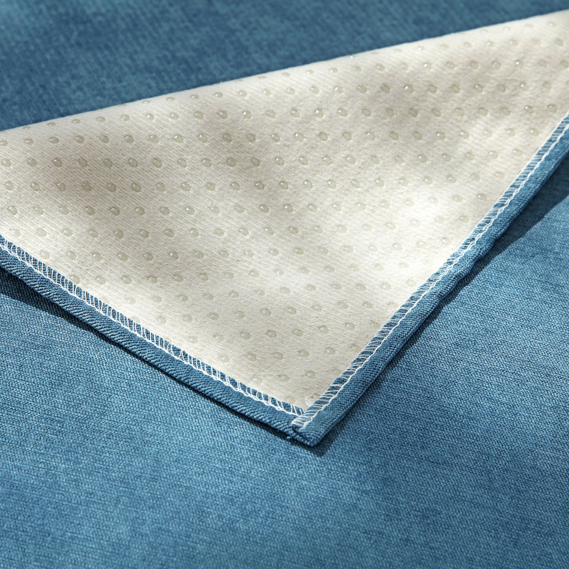 Underside view of Waterproof Non-Slip Quilted Corduroy Sofa Covers for Pets, Sectional Couch Covers showing non-slip texture.