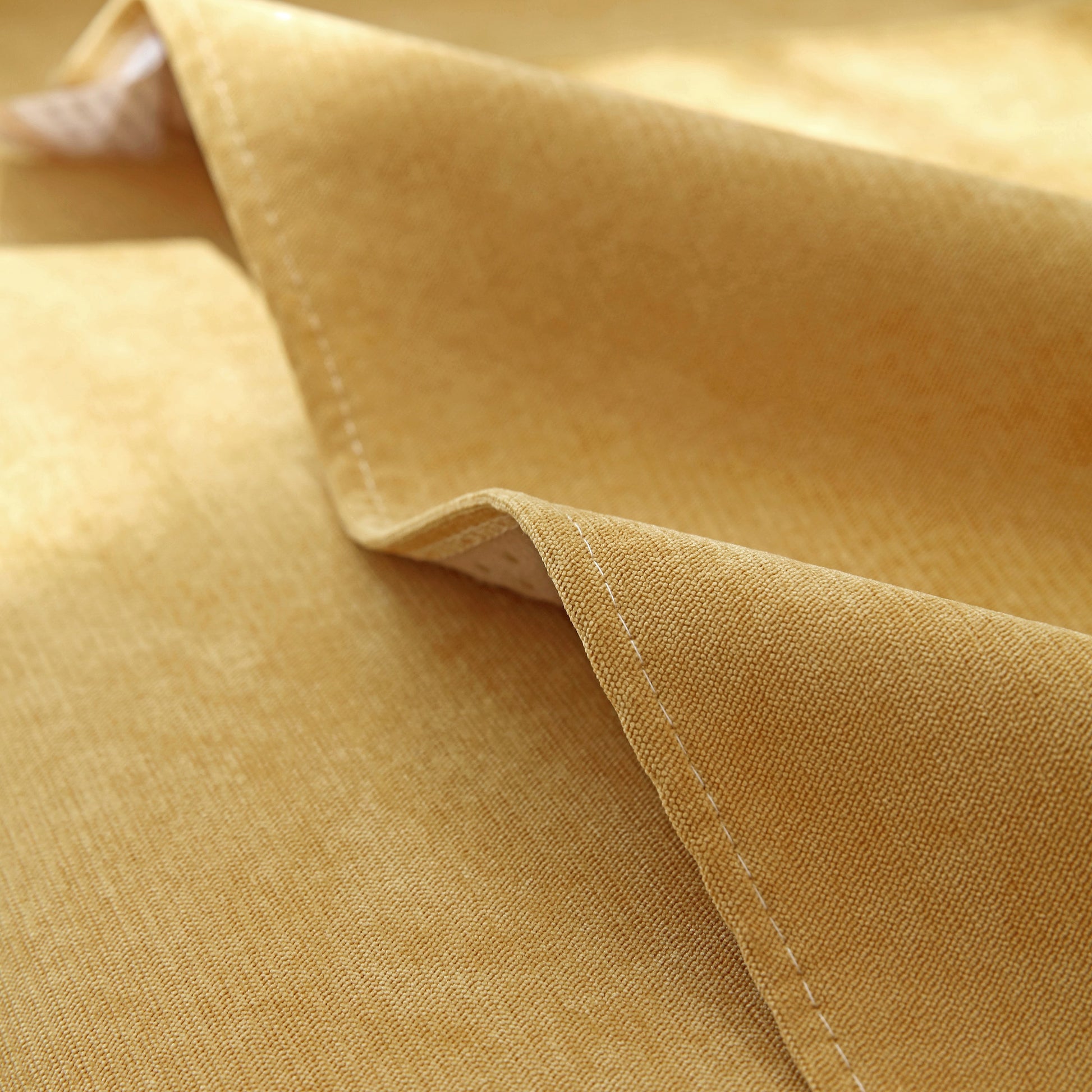 Close-up view of the quilted corduroy fabric of Waterproof Non-Slip Quilted Corduroy Sofa Covers for Pets, Sectional Couch Covers.