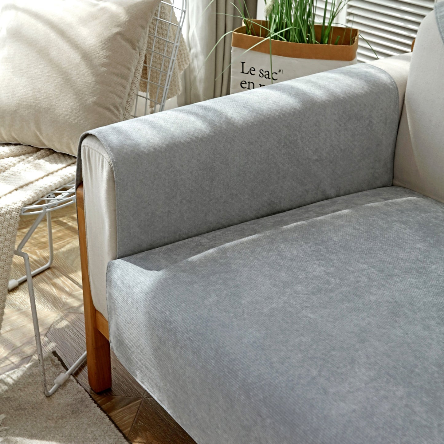 Waterproof Non-Slip Quilted Corduroy Sofa Covers for Pets, Sectional Couch Covers on a modern gray couch.