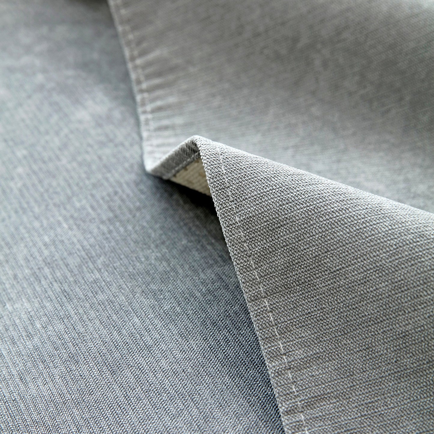 Close-up of Waterproof Non-Slip Quilted Corduroy Sofa Covers for Pets, Sectional Couch Covers texture in grey.