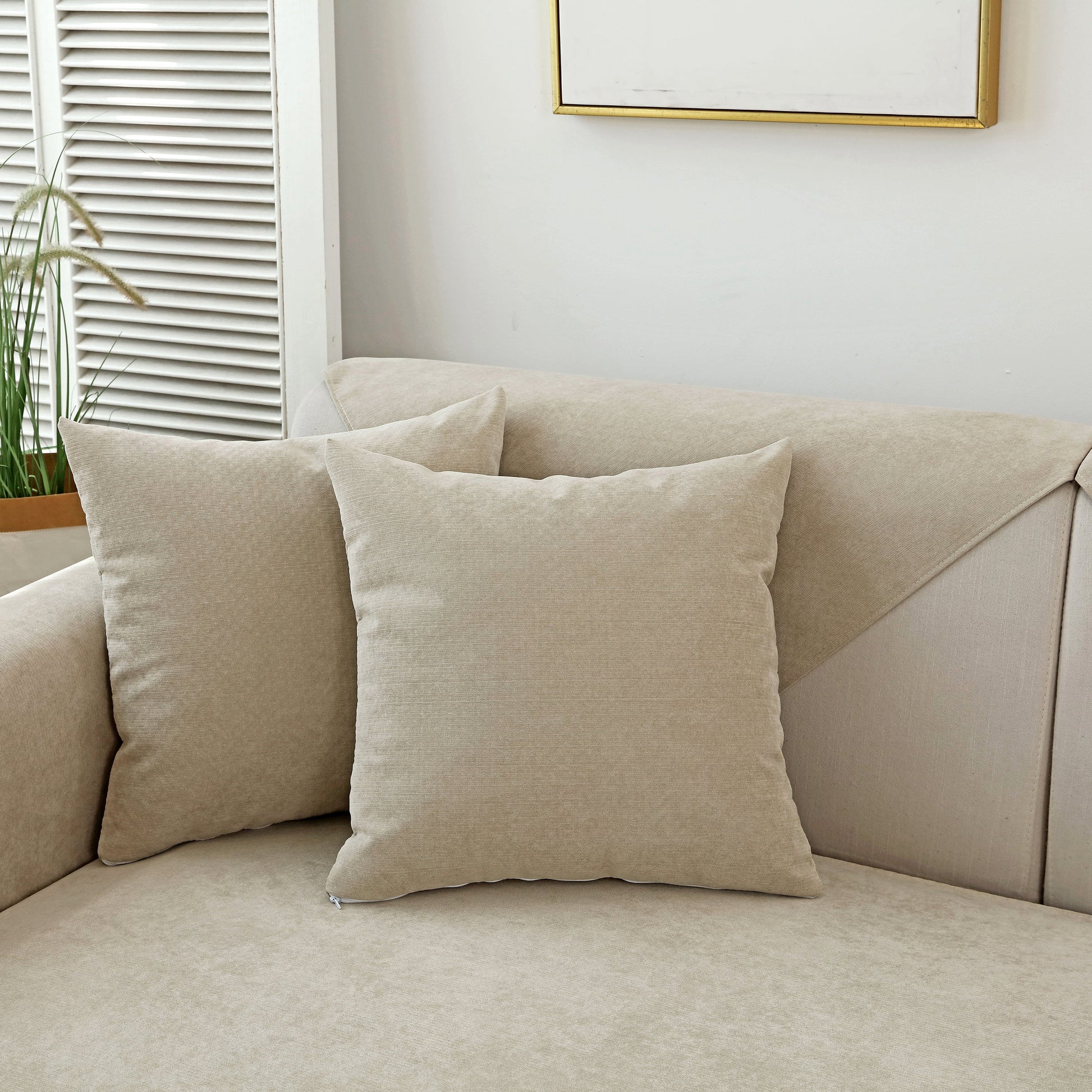 Waterproof Non-Slip Quilted Corduroy Sofa Covers for Pets, Sectional Couch Covers displayed on a beige sofa with decorative pillows.