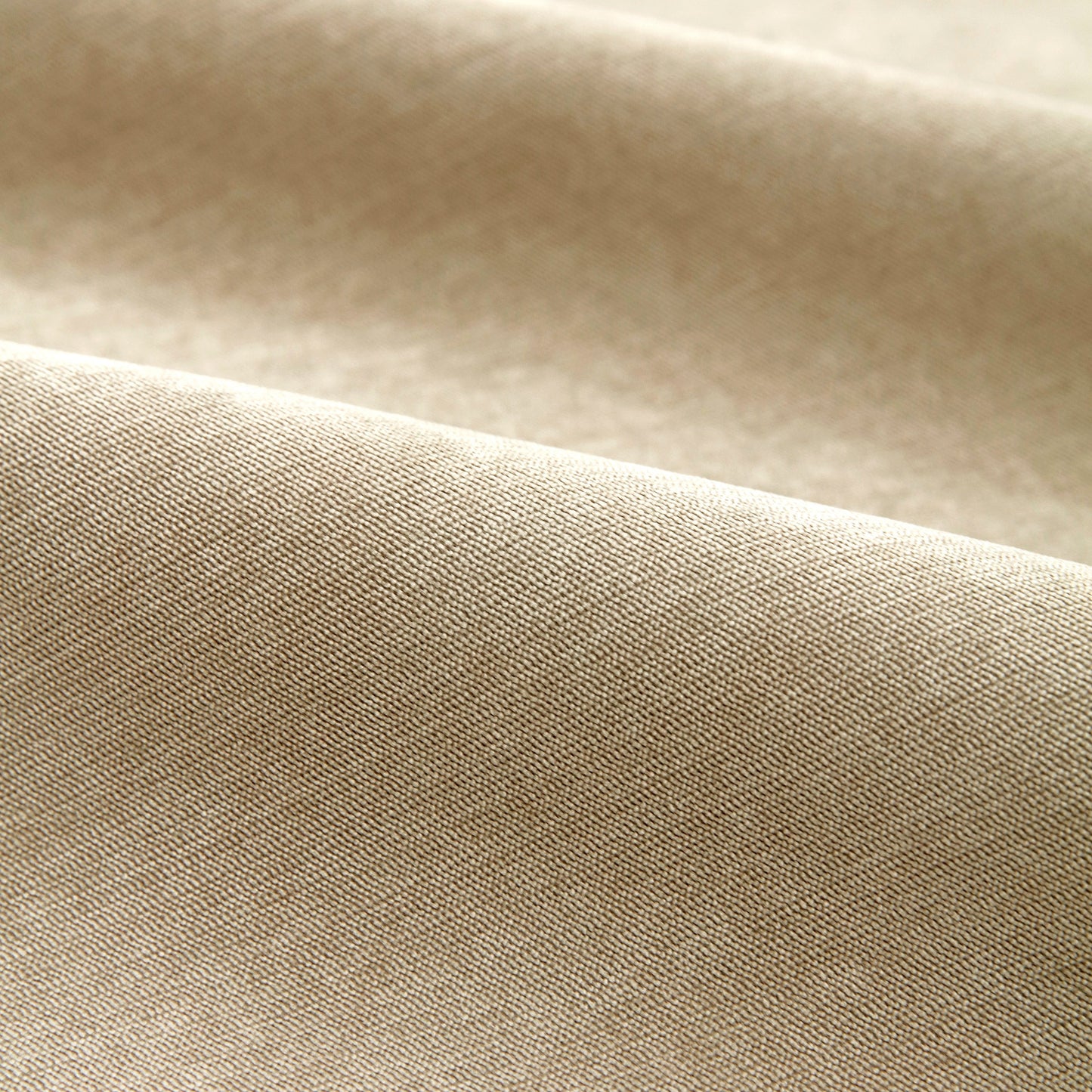 Close-up of beige corduroy fabric texture for Waterproof Non-Slip Quilted Corduroy Sofa Covers for Pets, Sectional Couch Covers.