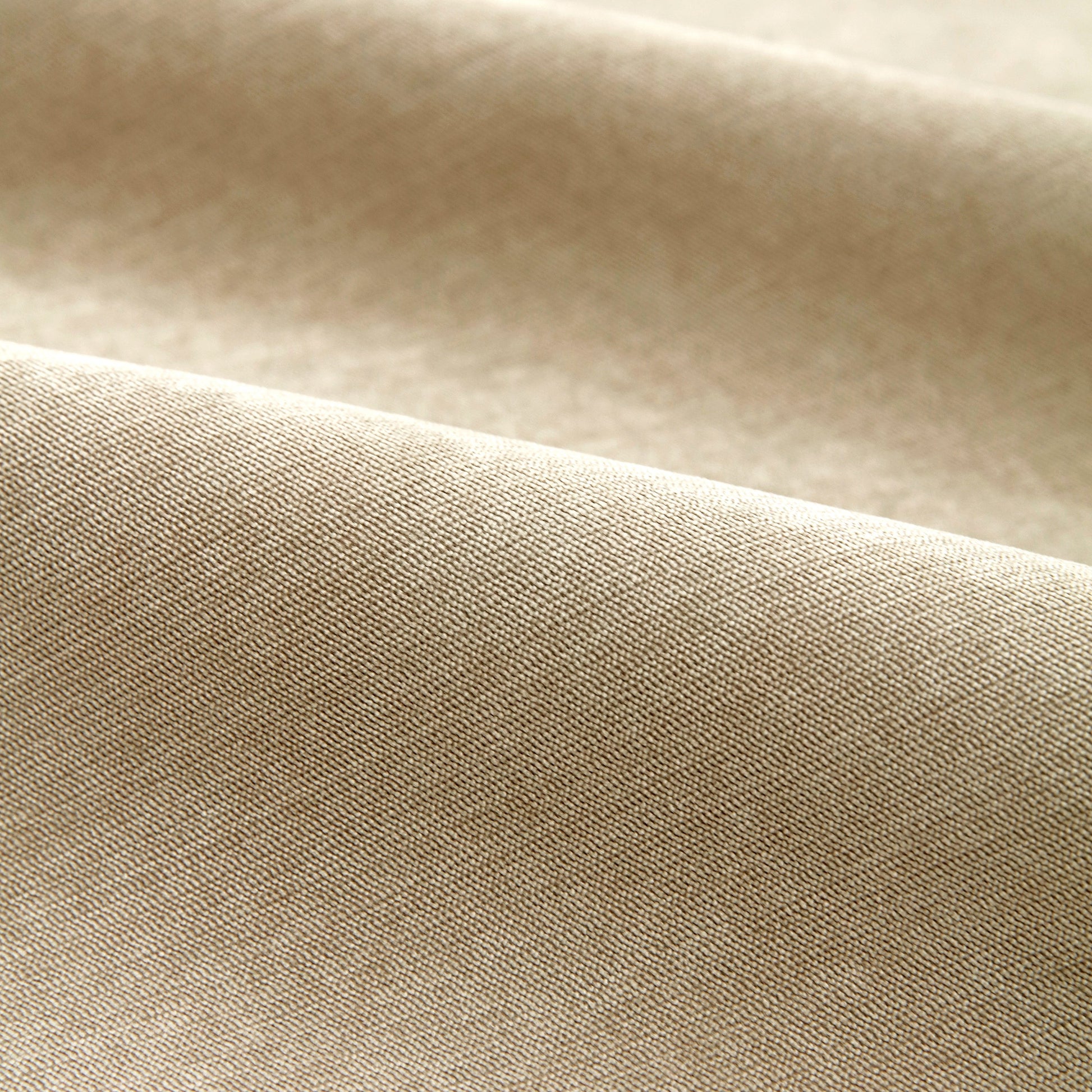 Close-up of beige corduroy fabric texture for Waterproof Non-Slip Quilted Corduroy Sofa Covers for Pets, Sectional Couch Covers.