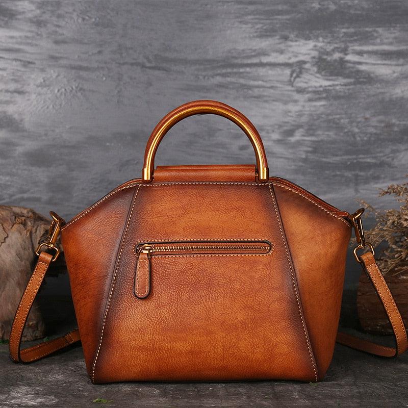 Mandala Embossed Leather Shoulder Bag with handcrafted cowhide and embossed mandala design, featuring leather-wrapped handle and metal fittings.