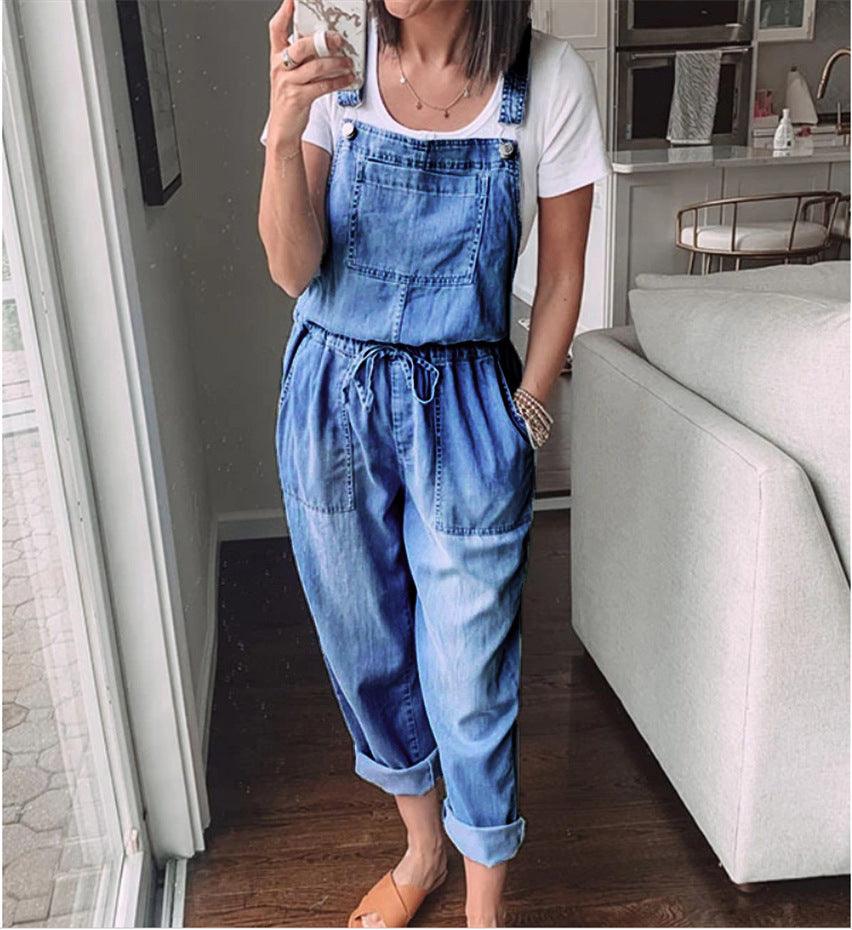 Woman wearing Cowgirl Drawstring Denim Overalls, showcasing its comfortable mid-waist fit and trendy washed denim design.