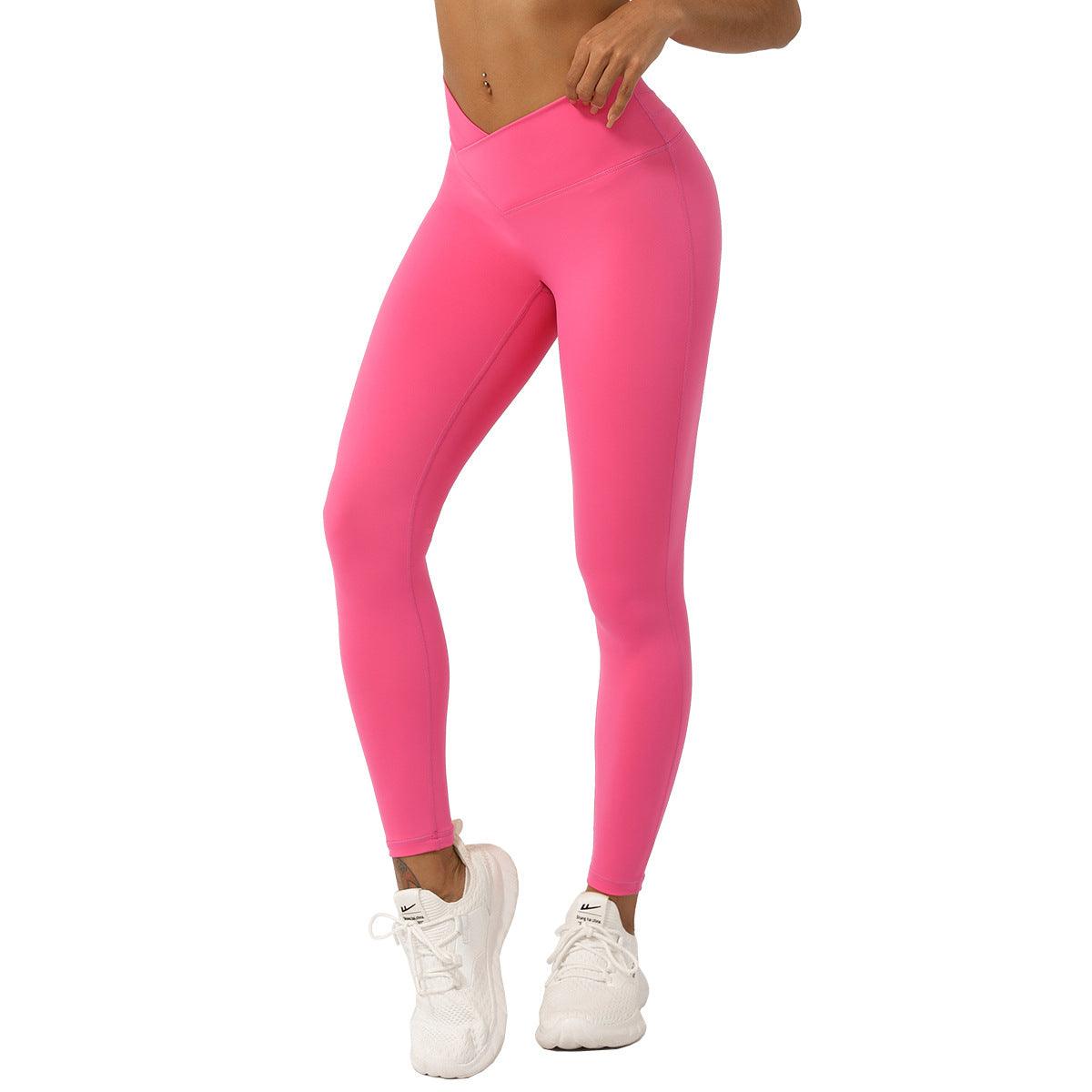 Woman wearing pink V-Shaped High-Waisted Yoga Pants | Skinny Fit Workout Pants for Fitness & Yoga, showcasing style and comfort.