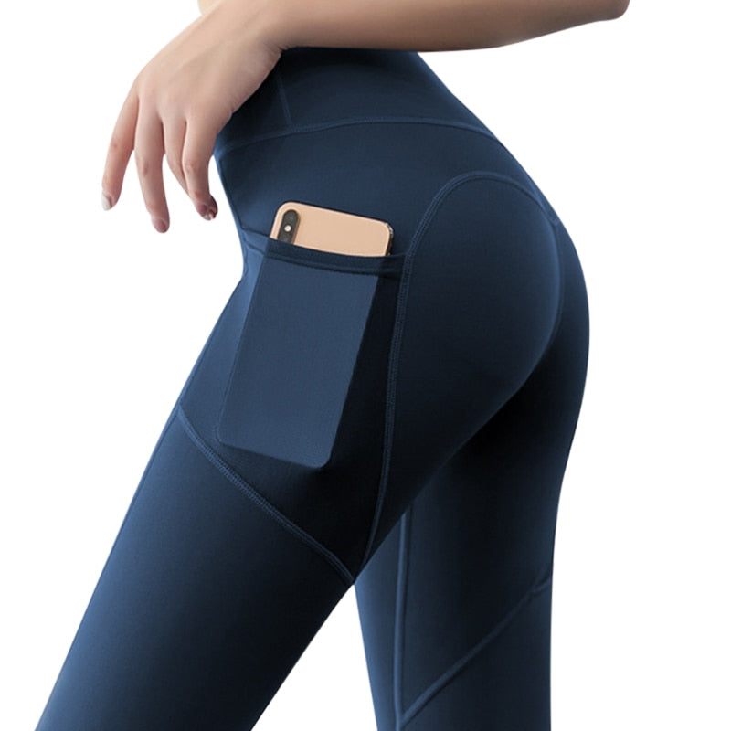 Woman wearing Yoga Leggings with Phone Pocket, featuring spliced pattern and breathable mesh, showcasing side phone pocket.