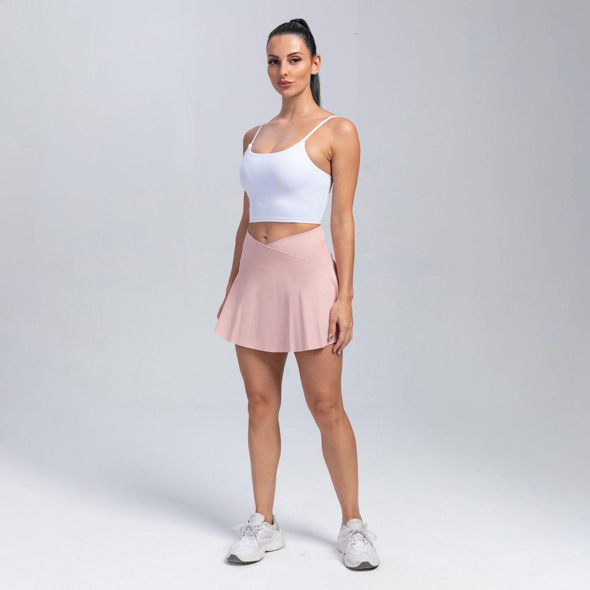 Woman wearing Cowgirl Fit High-Waisted Yoga Skirt Shorts in pink, sporty and stylish activewear.