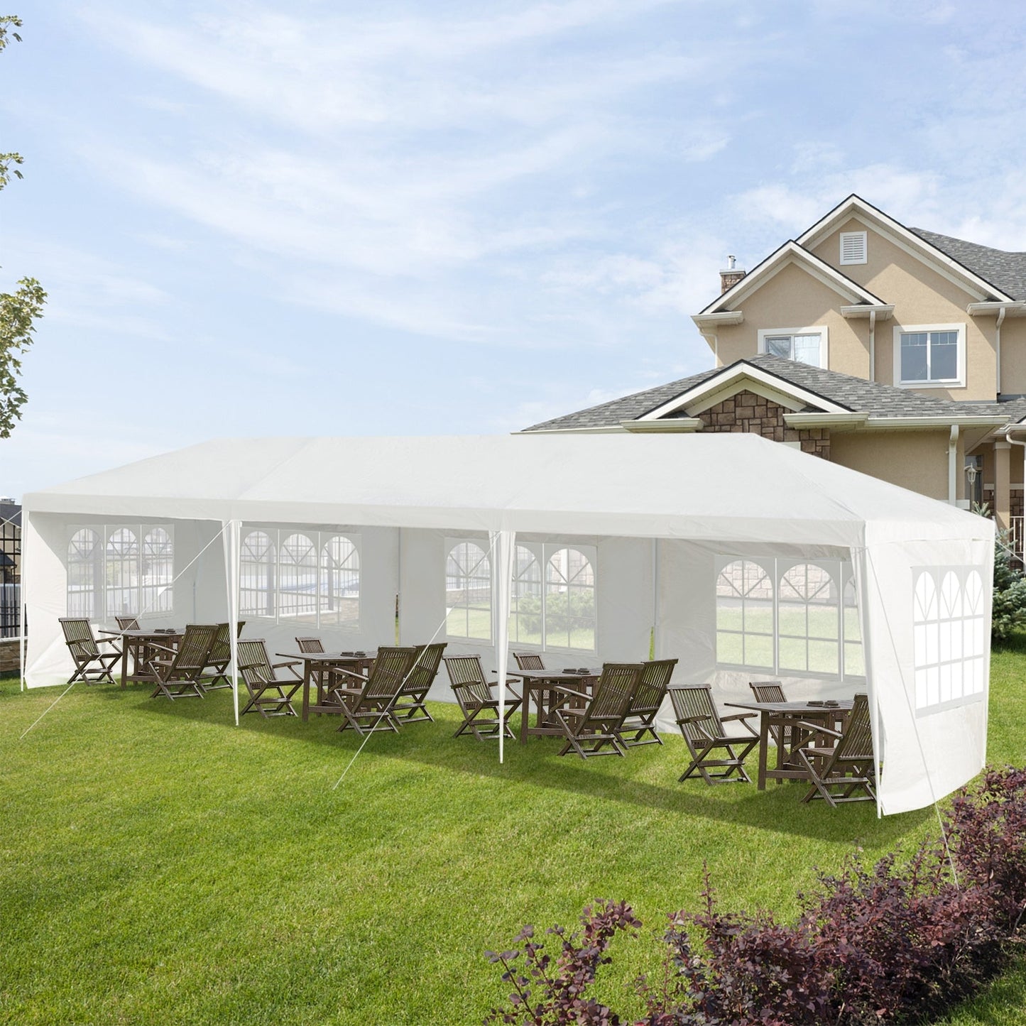 10 x 30 Feet Canopy Tent with 5 Removable Sidewalls for Party Wedding set up in a backyard with chairs and tables inside