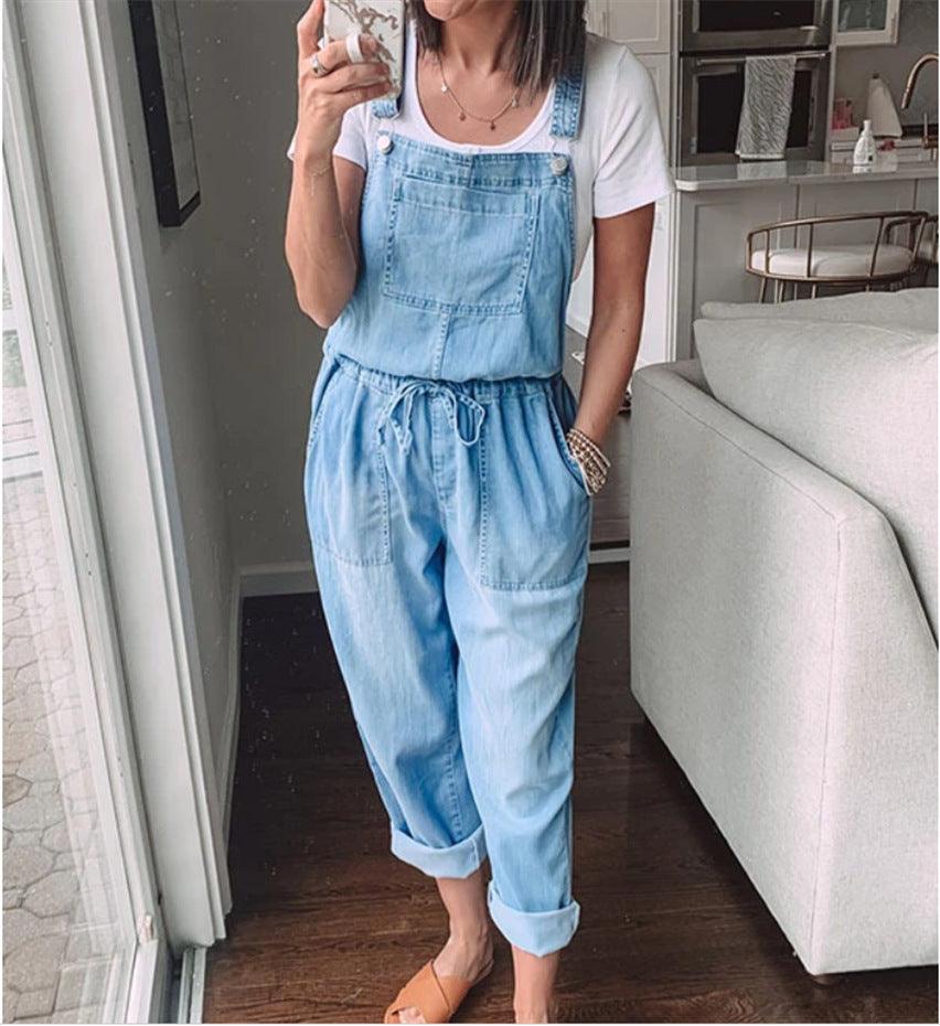 Woman wearing Cowgirl Drawstring Denim Overalls, stylish and comfortable for any cowgirl, in a casual indoor setting.
